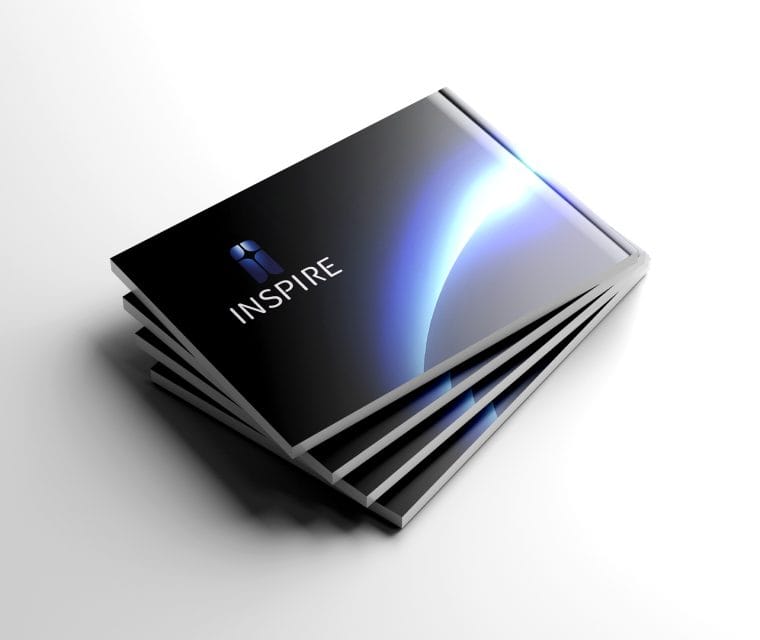Inspire company profile booklet mockup featuring a dark blue and black cover design.